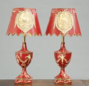 A PAIR OF PERIOD STYLE RED TOLE TABLE LAMPS