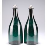 A PAIR OF EARLY 19TH CENTURY GREEN GLASS FLASK DECANTERS WITH SILVER-MOUNTED STOPPERS