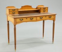 AN EDWARDIAN GOLDEN OAK WRITING DESK