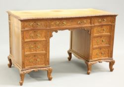 AN EARLY 20TH CENTURY CARVED WALNUT DESK