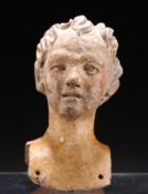 A TERRACOTTA HEAD OF A LADY