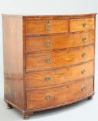 AN EARLY 19TH CENTURY MAHOGANY BOW FRONTED CHEST OF DRAWERS