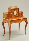 A FINE LOUIS XV STYLE GILT-METAL AND PORCELAIN MOUNTED WALNUT DESK