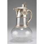 A CUT GLASS BALUSTER SHAPE CLARET JUG MOUNTED WITH SILVER PLATE