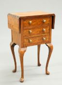 A SMALL BURR WALNUT DROP LEAF CHEST OF DRAWERS