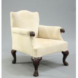 A HANDSOME CARVED AND UPHOLSTERED ARMCHAIR