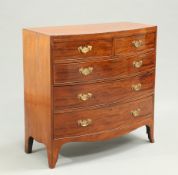 AN EARLY 19TH CENTURY MAHOGANY BOW-FRONT CHEST OF DRAWERS