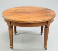 A LATE VICTORIAN MAHOGANY EXTENDING DINING TABLE