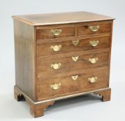 A GEORGE III STYLE CROSSBANDED MAHOGANY CHEST OF DRAWERS