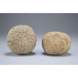 TWO ROMAN-BRITISH PERIOD BALLISTA BALLS