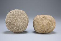 TWO ROMAN-BRITISH PERIOD BALLISTA BALLS