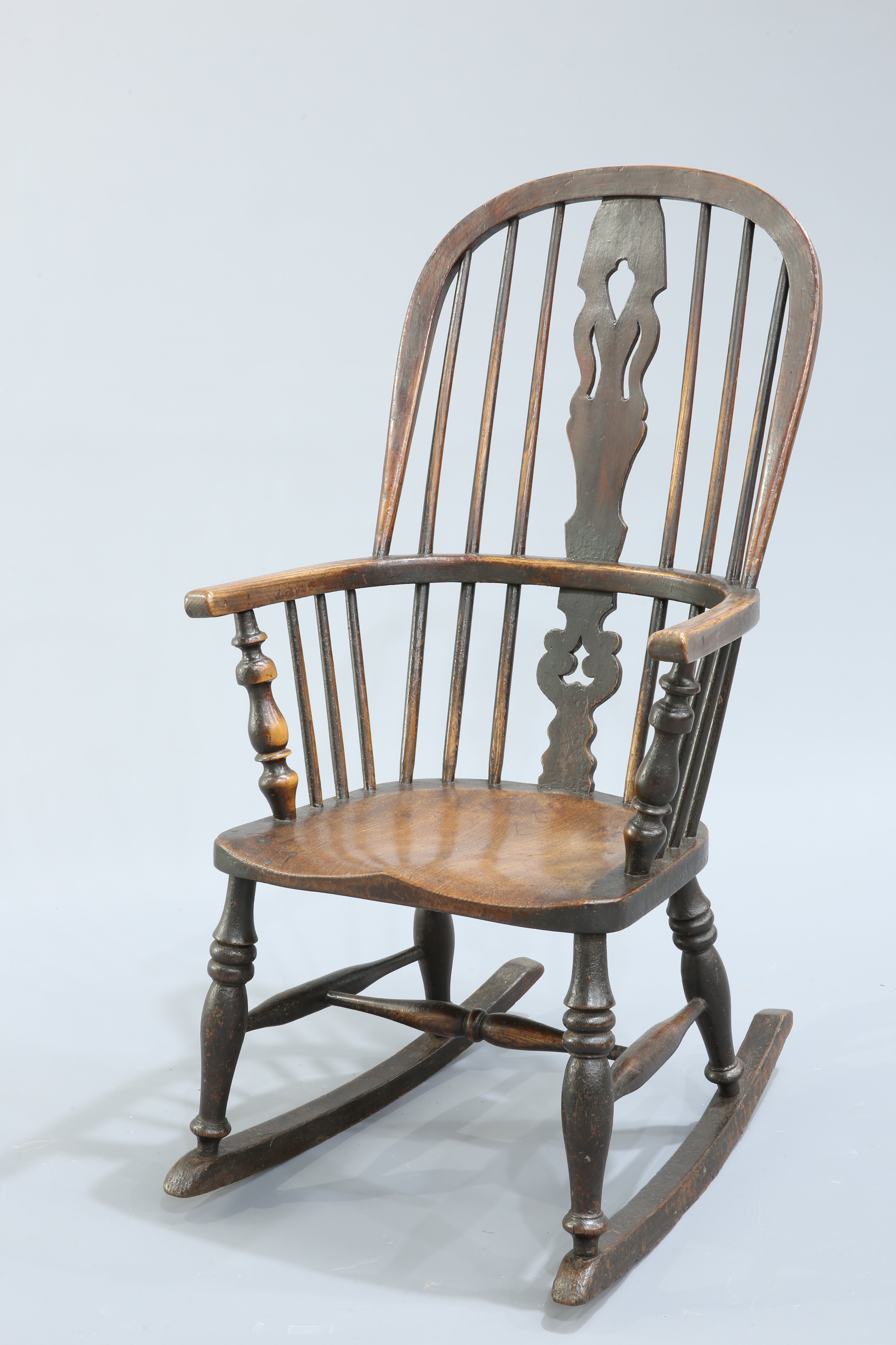 AN ELM AND OAK WINDSOR ROCKING CHAIR