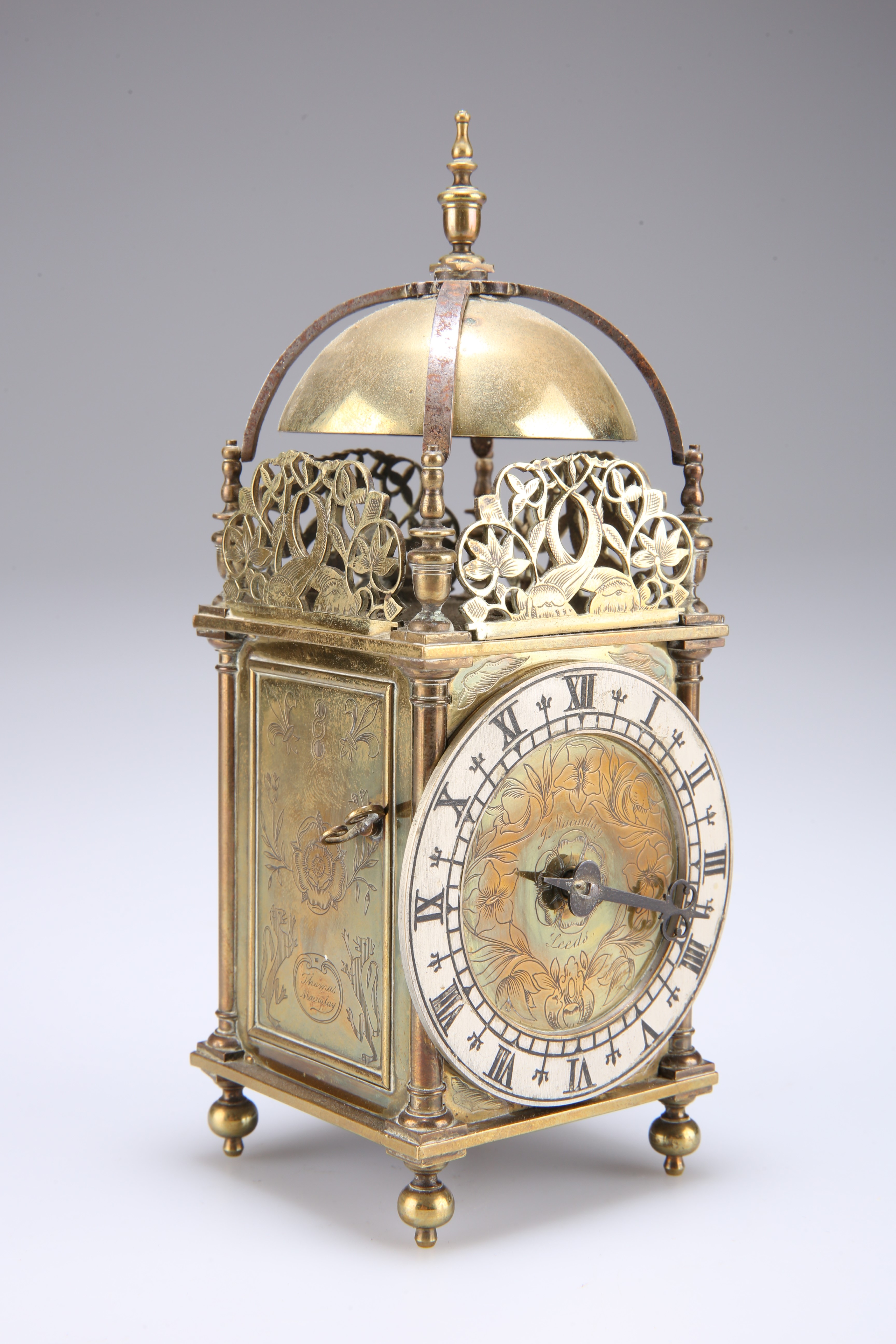 A BRASS CASED LANTERN CLOCK