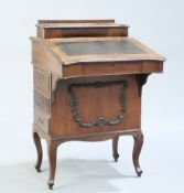 A LATE VICTORIAN WALNUT DAVENPORT