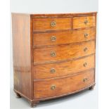 AN EARLY 19TH CENTURY MAHOGANY BOW FRONTED CHEST O