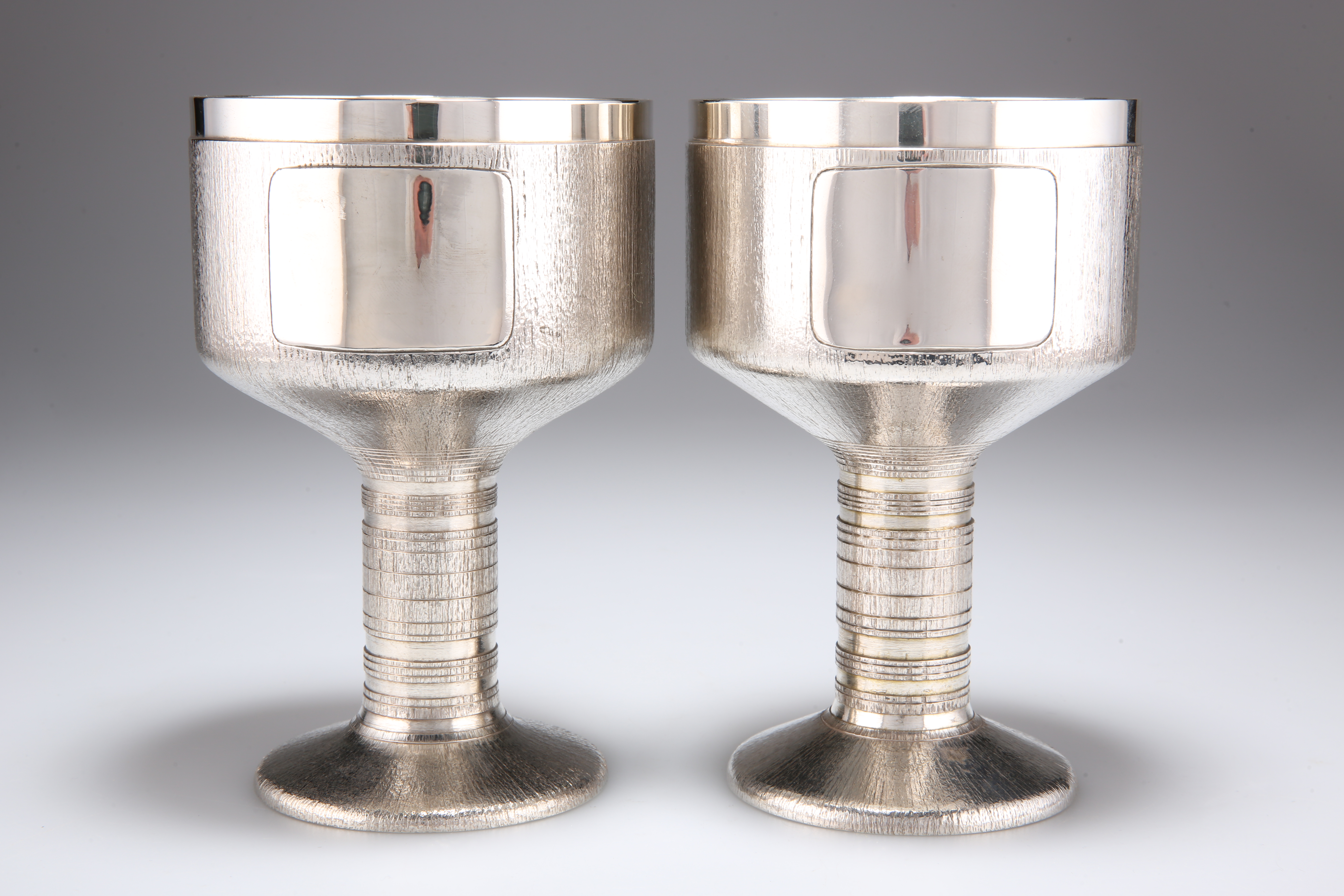 CHRISTOPHER NIGEL LAWRENCE (BORN 1936), A PAIR OF ELIZABETH II HEAVY SILVER GOBLETS