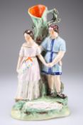 A VICTORIAN STAFFORDSHIRE POTTERY FIGURE GROUP SPILL VASE