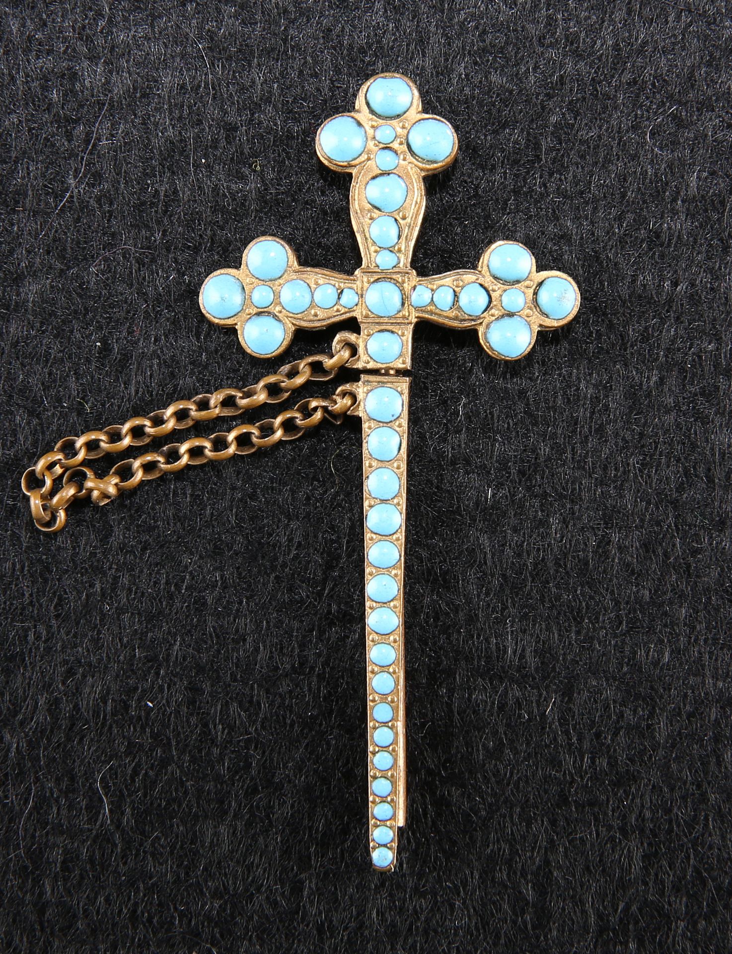 A 19TH CENTURY GILT METAL AND TURQUOISE SET SWORD PIN