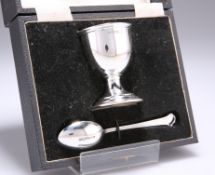 A GEORGE V SILVER EGG CUP AND SPOON