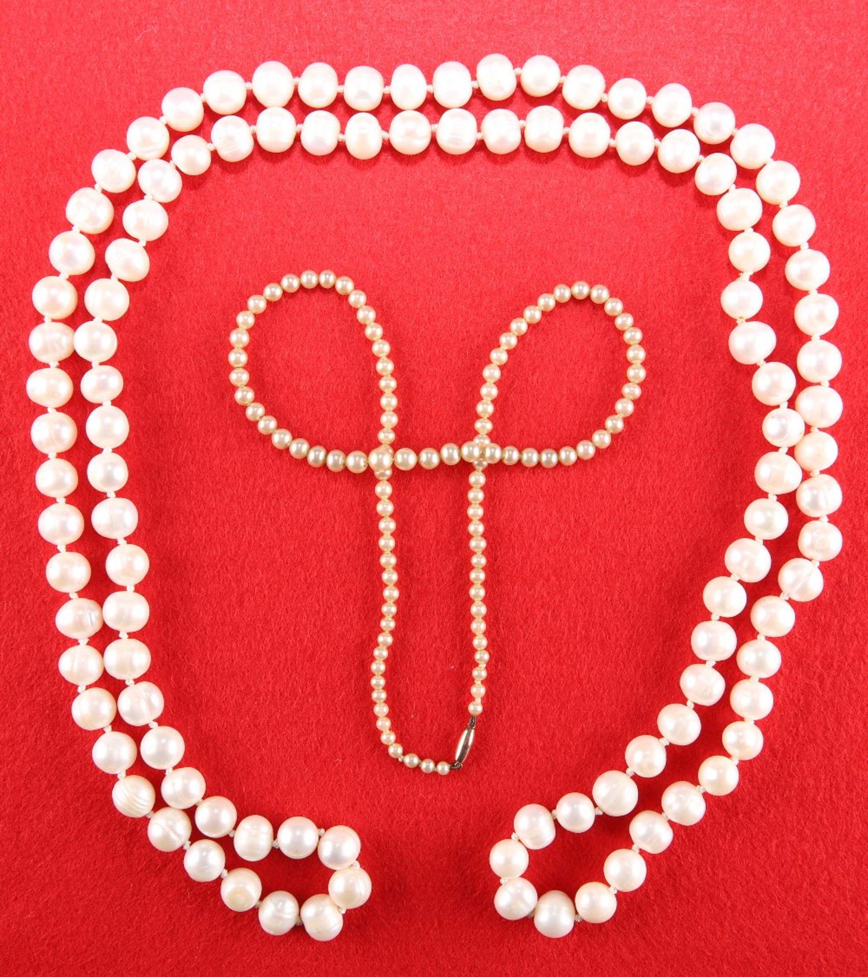 A CONTINUOUS CULTURED PEARL NECKLACE AND A SIMULATED PEARL NECKLACE