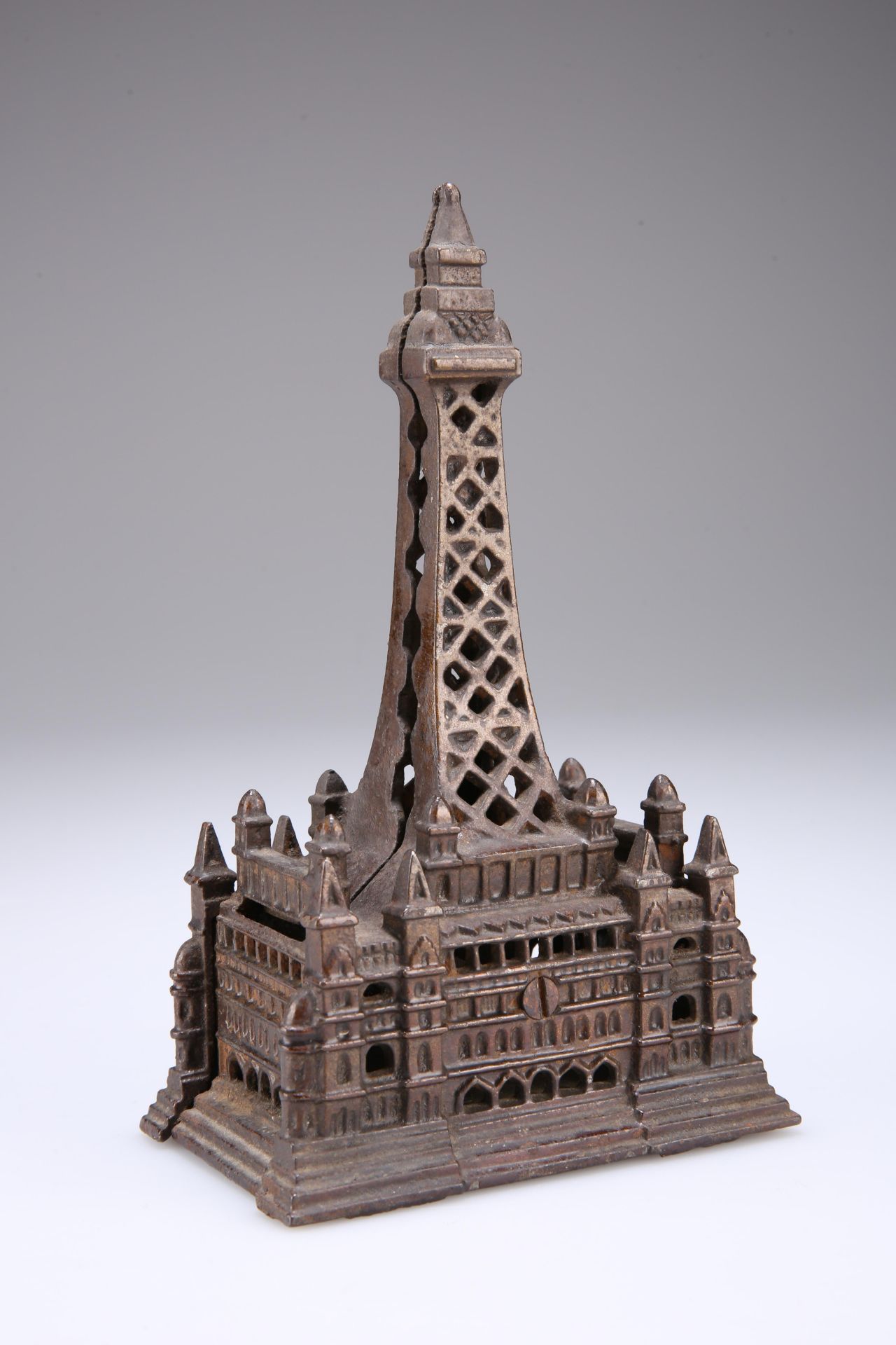 AN EDWARDIAN CAST IRON MONEY BOX IN THE FORM OF BLACKPOOL TOWER