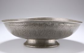 A TUDRIC PEWTER HAMMERED FOOTED BOWL