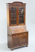 A 1920'S MAHOGANY BUREAU BOOKCASE