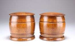 A PAIR OF CIRCA 1950 OAK TOBACCO JARS