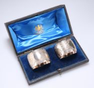 A PAIR OF VICTORIAN ENGRAVED SILVER NAPKIN RINGS