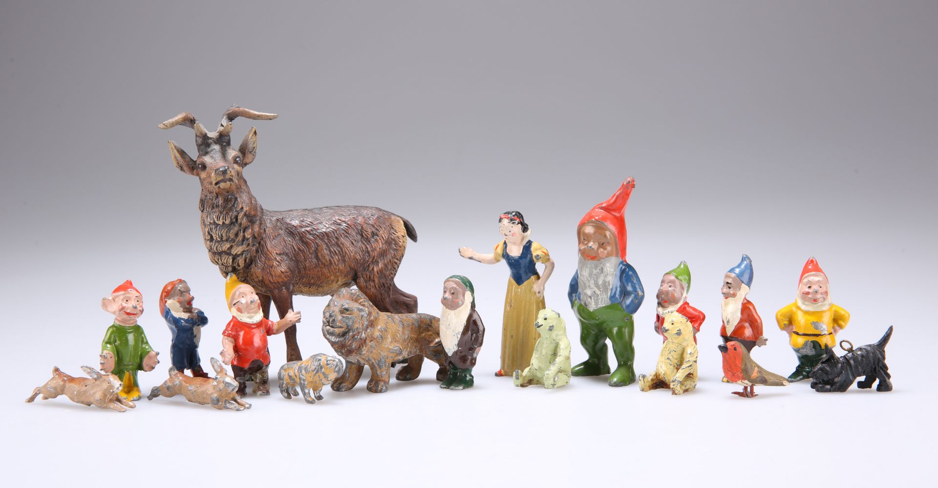 A SET OF PAINTED METAL FIGURES OF SNOW WHITE AND THE SEVEN DWARFS