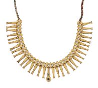 AN INDIAN SIMULATED PEARL AND PASTE NECKLET