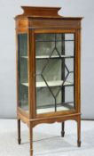 AN EDWARDIAN STRING INLAID MAHOGANY VITRINE