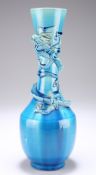 A JAPANESE BLUE GLAZED POTTERY DRAGON VASE