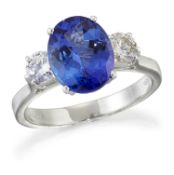 AN 18 CARAT WHITE GOLD TANZANITE AND DIAMOND THREE-STONE RING