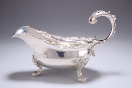 A LARGE GEORGE IV CAST SILVER SAUCE BOAT