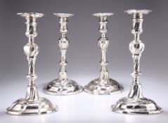 A SET OF FOUR GEORGE II CAST SILVER CANDLESTICKS