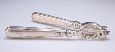 A PAIR OF GEORGE V SILVER-HANDLED NUT CRACKERS