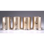 A HARLEQUIN SET OF FOUR VICTORIAN SILVER-GILT PINT MUGS