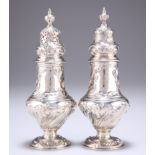 A PAIR OF EARLY GEORGE III HEAVY SILVER SUGAR CASTERS