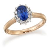 AN 18 CARAT ROSE GOLD SAPPHIRE AND DIAMOND CLUSTER RING