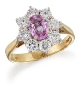 AN 18 CARAT GOLD PINK SAPPHIRE AND DIAMOND CLUSTER RING