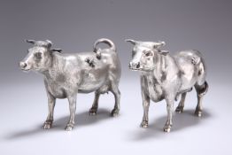 A PAIR OF SILVER MODELS OF CATTLE