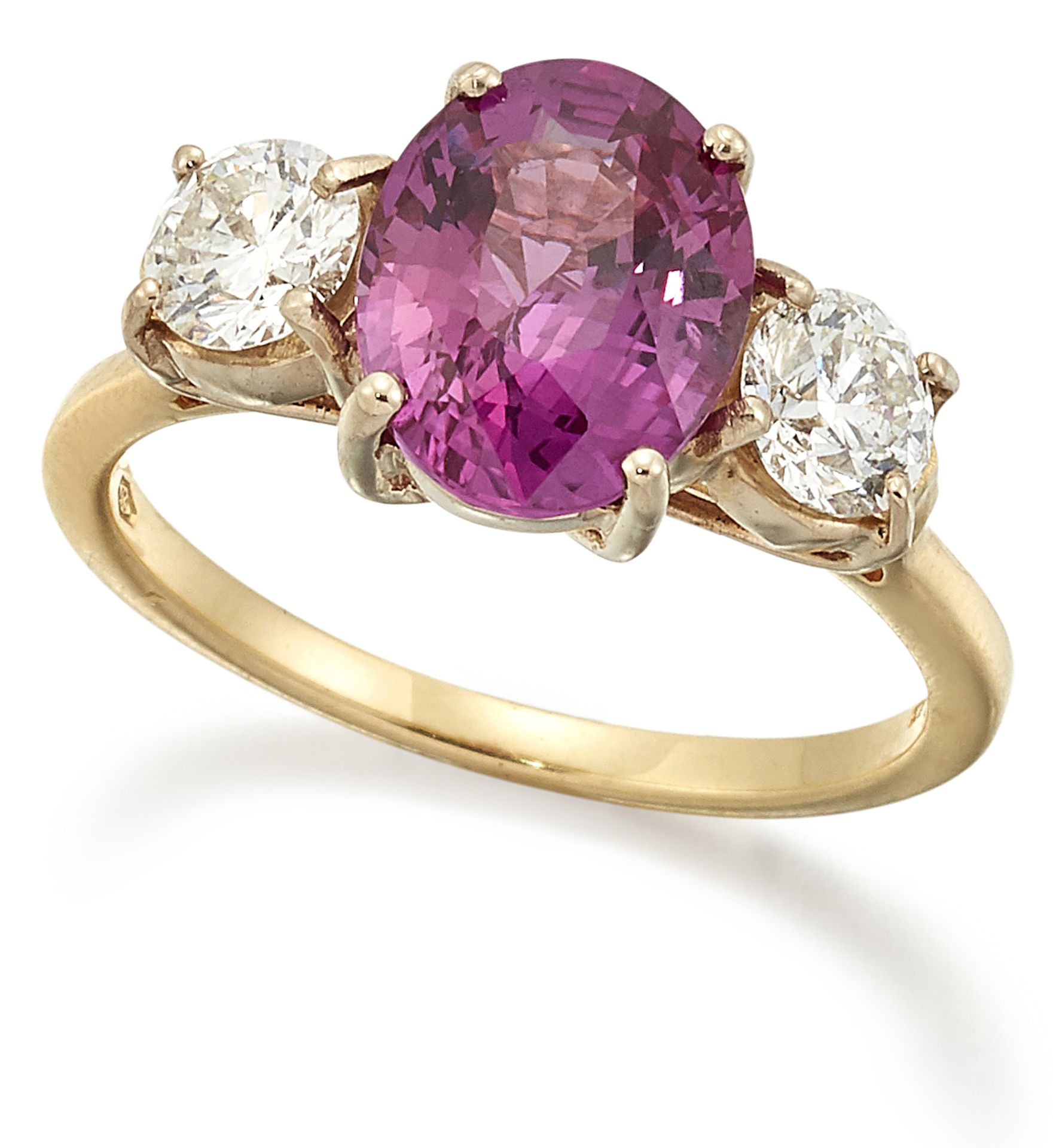 AN 18 CARAT GOLD PINK SAPPHIRE AND DIAMOND RING