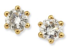 A PAIR OF 18 CARAT GOLD SOLITAIRE DIAMOND EARRINGS