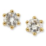 A PAIR OF 18 CARAT GOLD SOLITAIRE DIAMOND EARRINGS