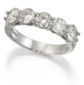 A PLATINUM HALF HOOP DIAMOND RING