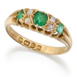 AN 18 CARAT GOLD EMERALD AND DIAMOND RING