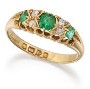 AN 18 CARAT GOLD EMERALD AND DIAMOND RING