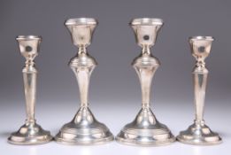 TWO PAIRS OF ELIZABETH II SILVER CANDLESTICKS