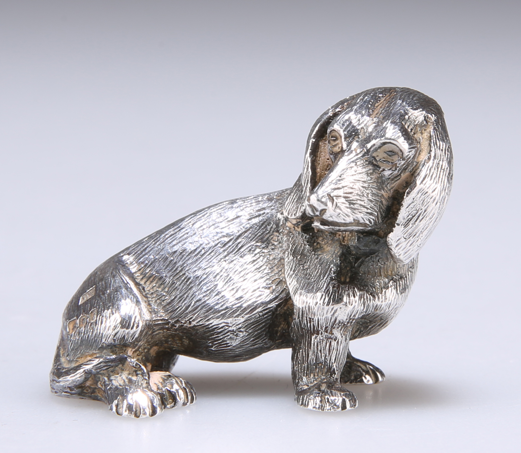 AN ELIZABETH II SILVER NOVELTY MODEL OF A DOG